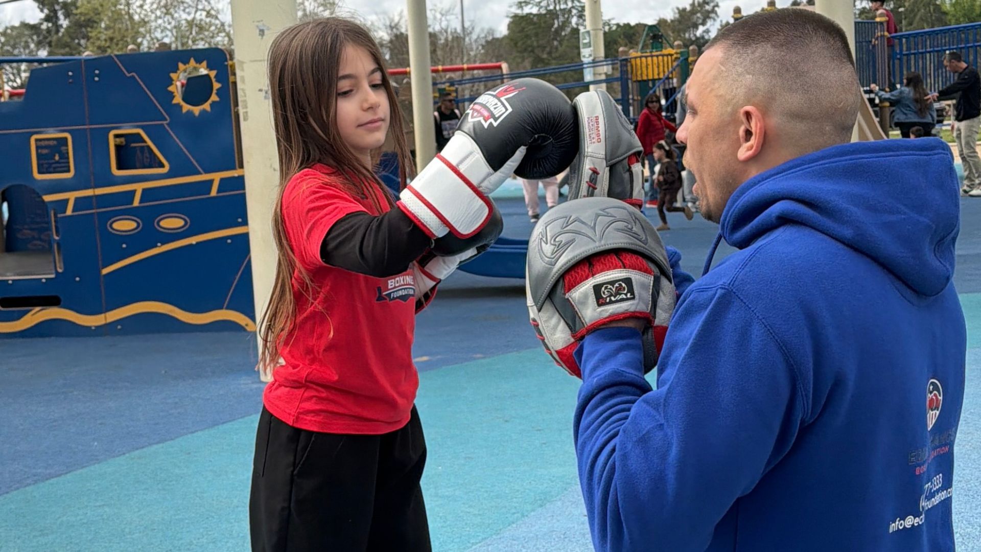 Home group of diverse kids warming up for outdoor boxing class
